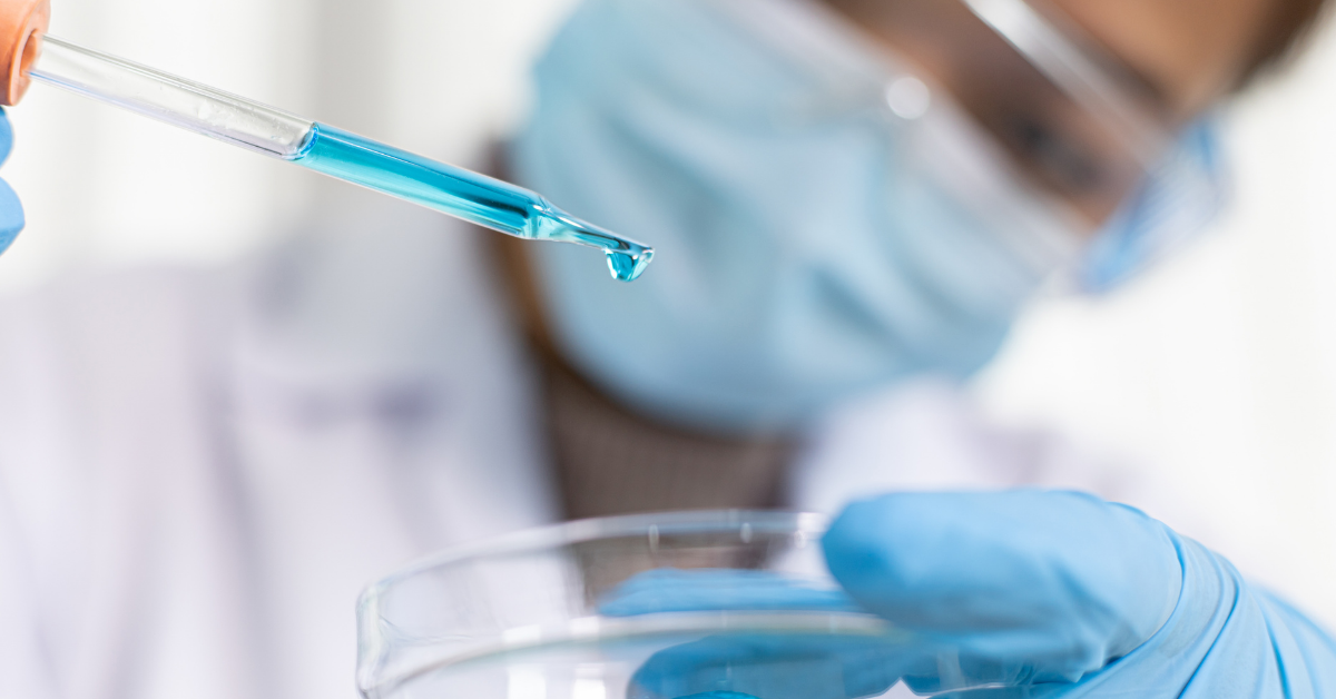 A scientist working in a life science lab holding a petri dish